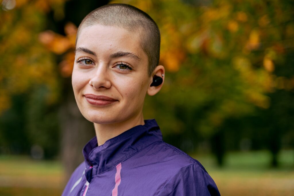 a women with short hair who is a breast cancer survivor 
