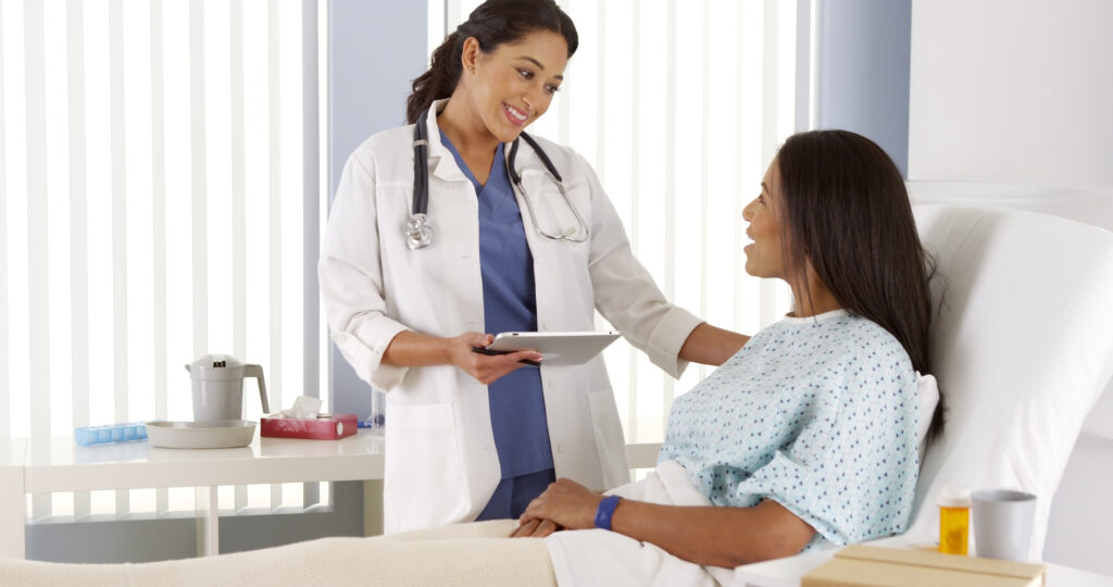 a female discusses women's health with a female patient