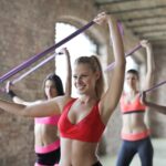 three women doing wellness exercises