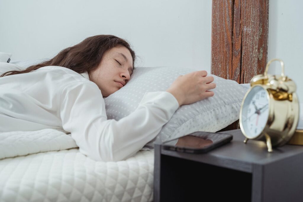 a person demonstrating how to revitalize for life with good sleep in bed on a nice pillow