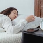 a person demonstrating how to revitalize for life with good sleep in bed on a nice pillow