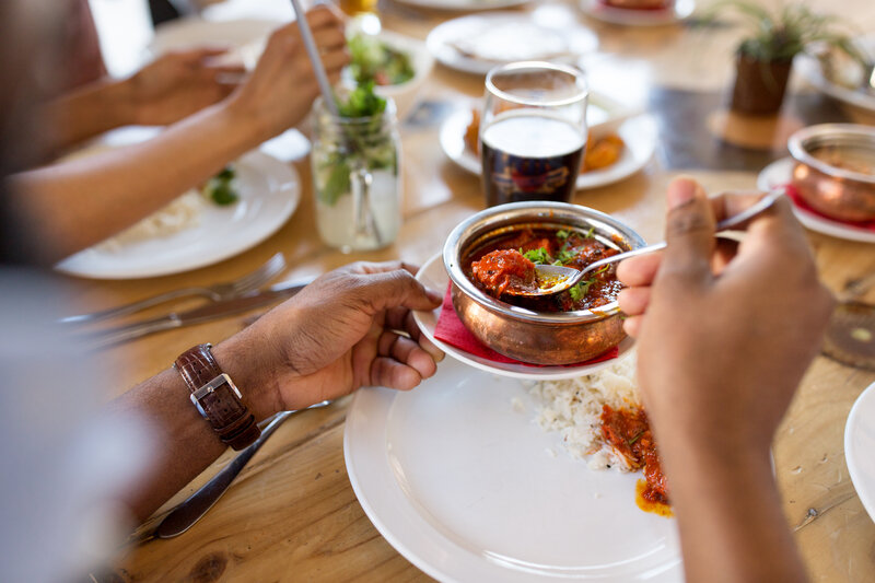 a person eating with ba spoon from a bowl part of balanced wellness